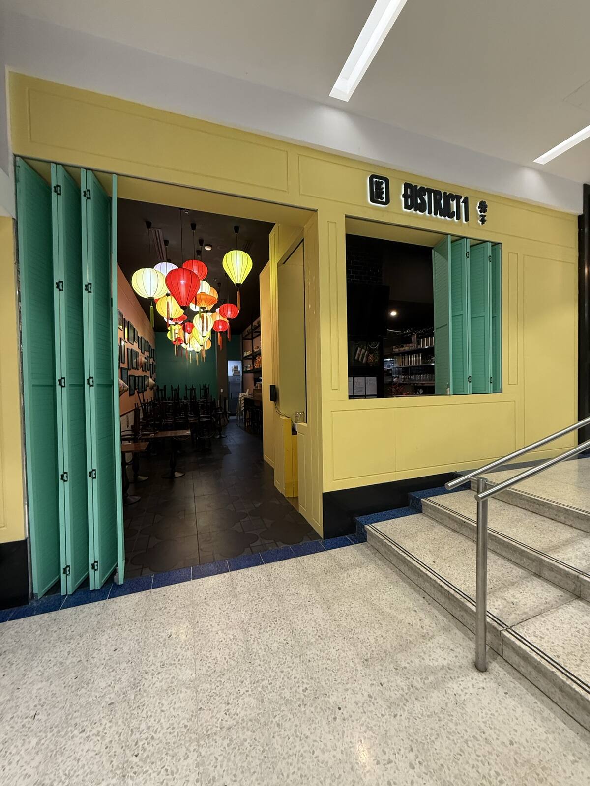 District 1 Vietnamese Eatery interior with lantern lighting and teal joinery